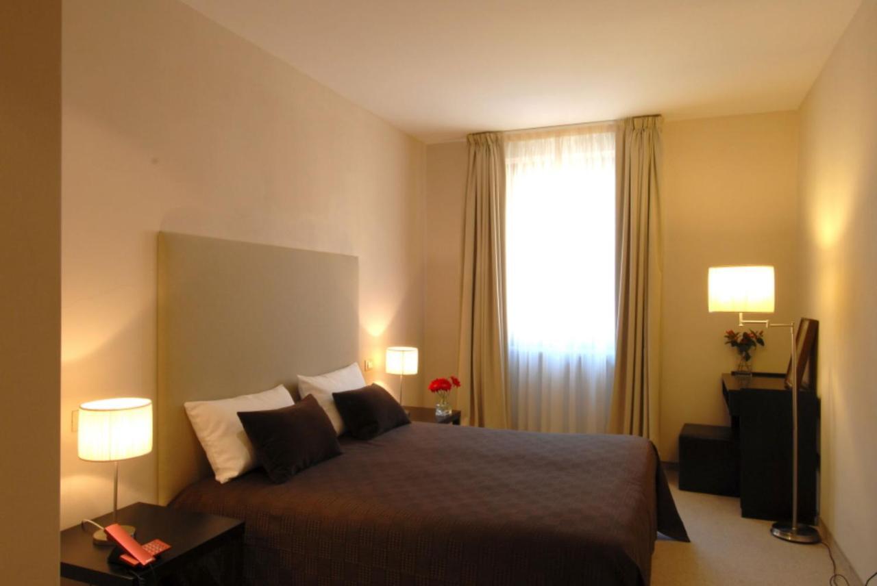 Hotel Touring Ливорно Номер фото